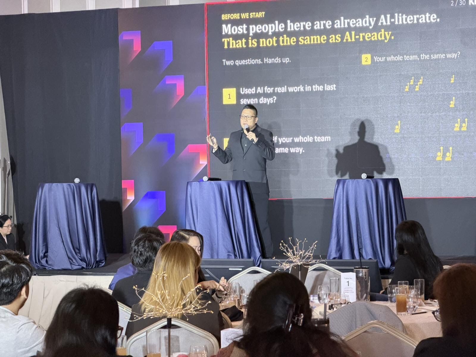Jay Jaboneta presenting the slide 'Most people here are already AI-literate. That is not the same as AI-ready.' at CGI's PGDC Leadership Connect 2026