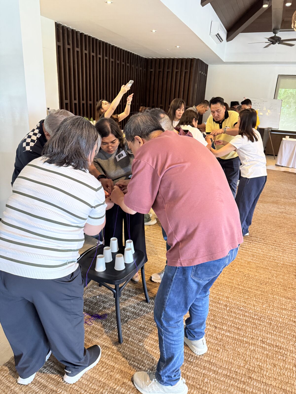 Global Payments leaders pulling strings together to stack cups during HOPE in Action